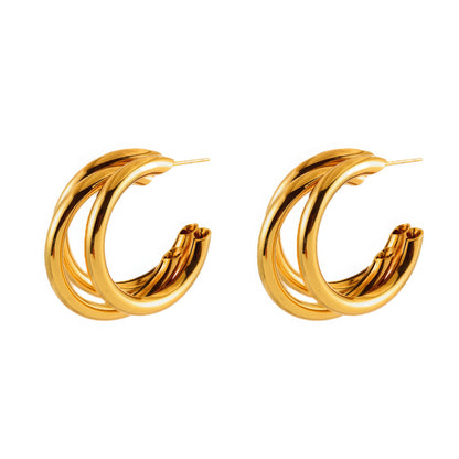 Pair of gold unique - shaped hoop earrings, emphasizing the sleek, multi - layered design