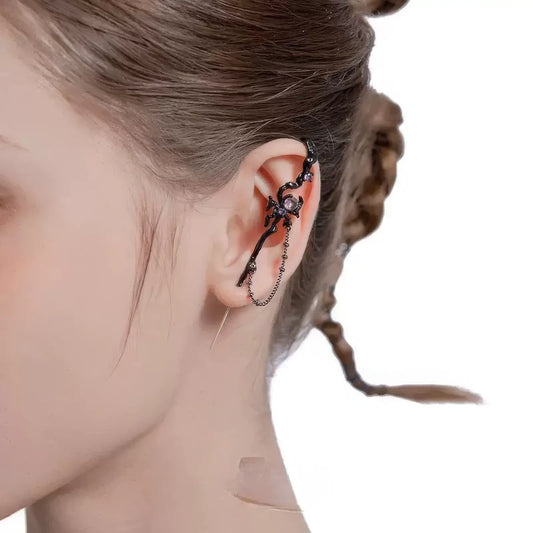  Web - themed trendy piercing ear cuff worn on ear, highlighting the intricate web and spider design.