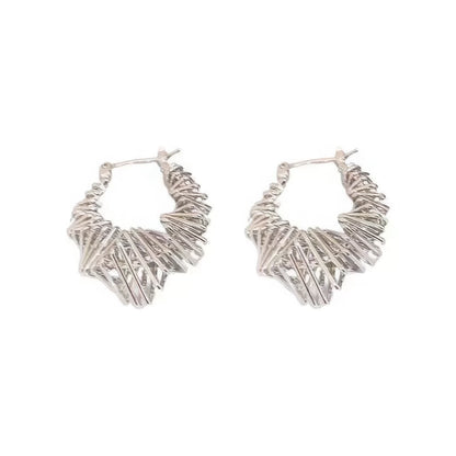  Pair of silver wrapped metal circle earrings, isolated on white background, highlighting the detailed, twisted metal structure