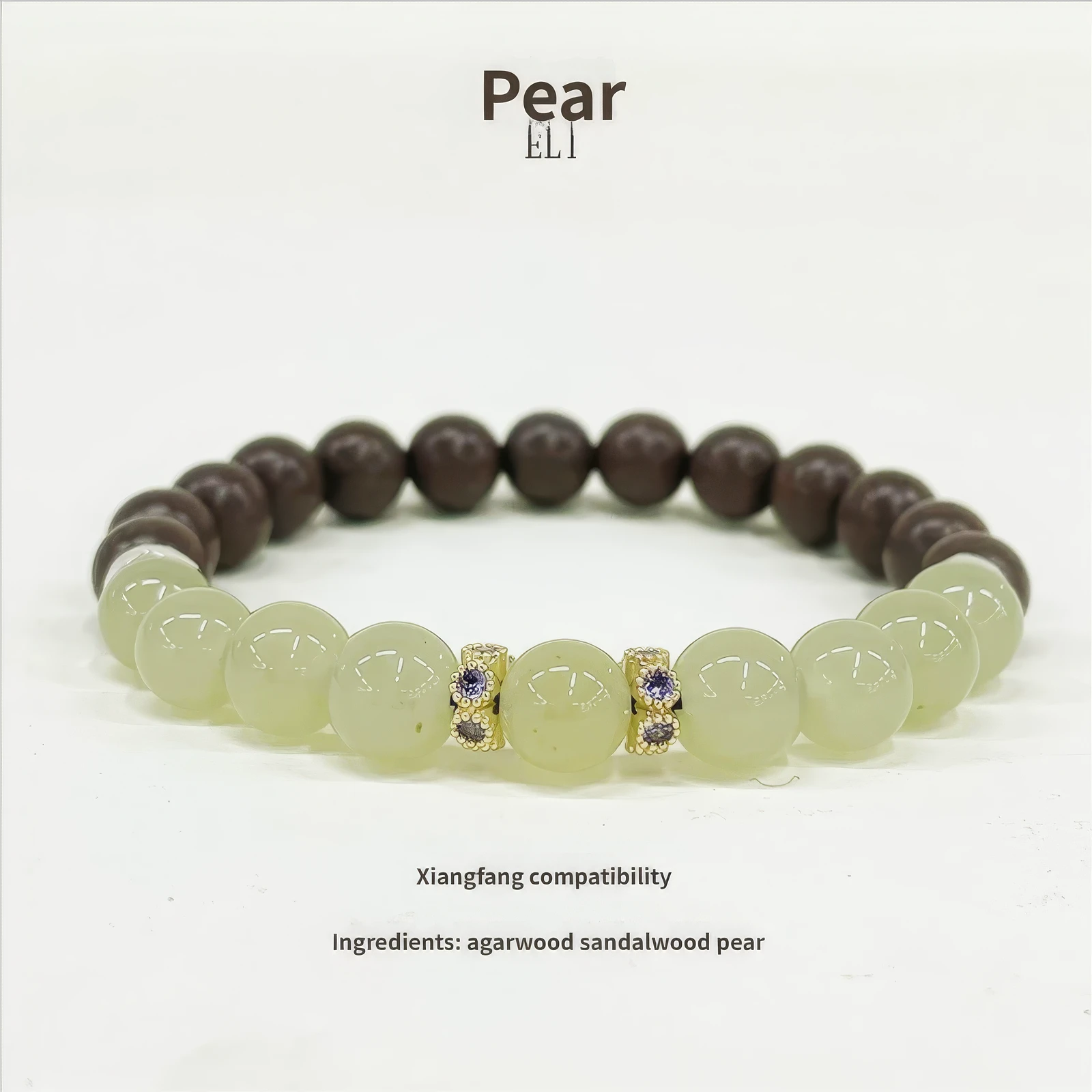Another full - view of the Xiangning natural Chinese medicine bracelet on a white background, labeled "Pear", with text about "Xiangfang compatibility" and ingredient list.