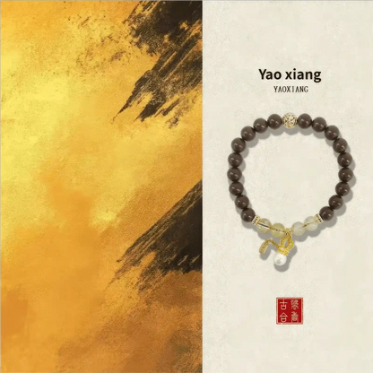  Yao Xiang natural Chinese medicine incense bead bracelet displayed against a warm, golden - toned abstract background, labeled "Yao xiang".