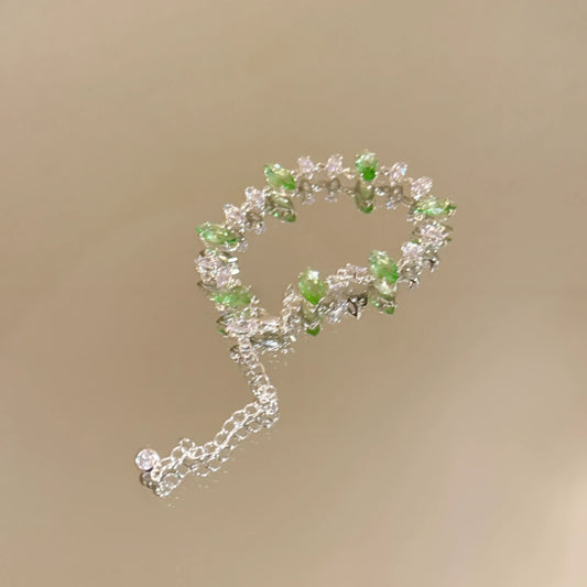 Zircon colorful oval bracelet isolated on a light background, with green - toned ovals.