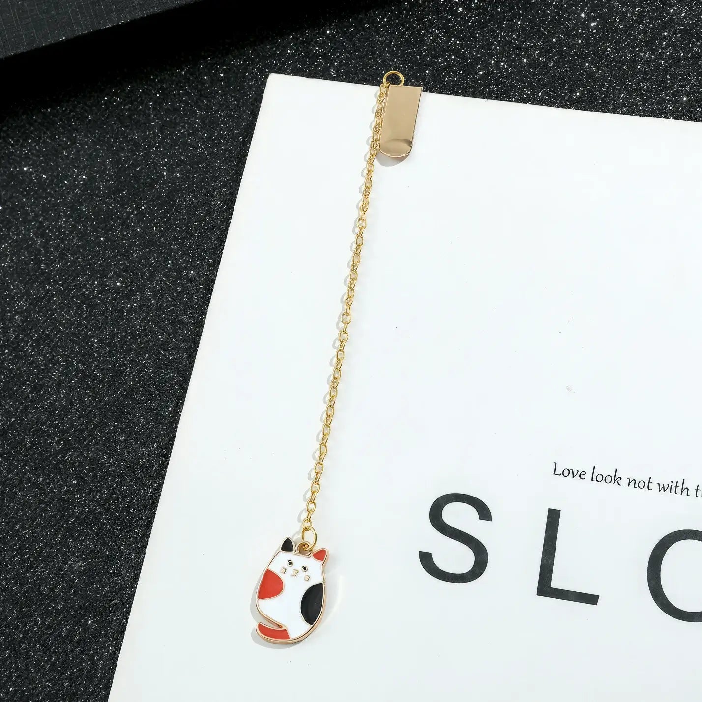 Animal and plant themed bookmark with cat charm, golden chain, on "SLC" card