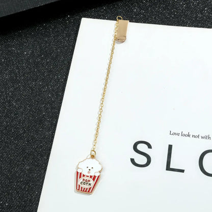 Animal and plant themed bookmark with cupcake charm, golden chain, on "SLC" card