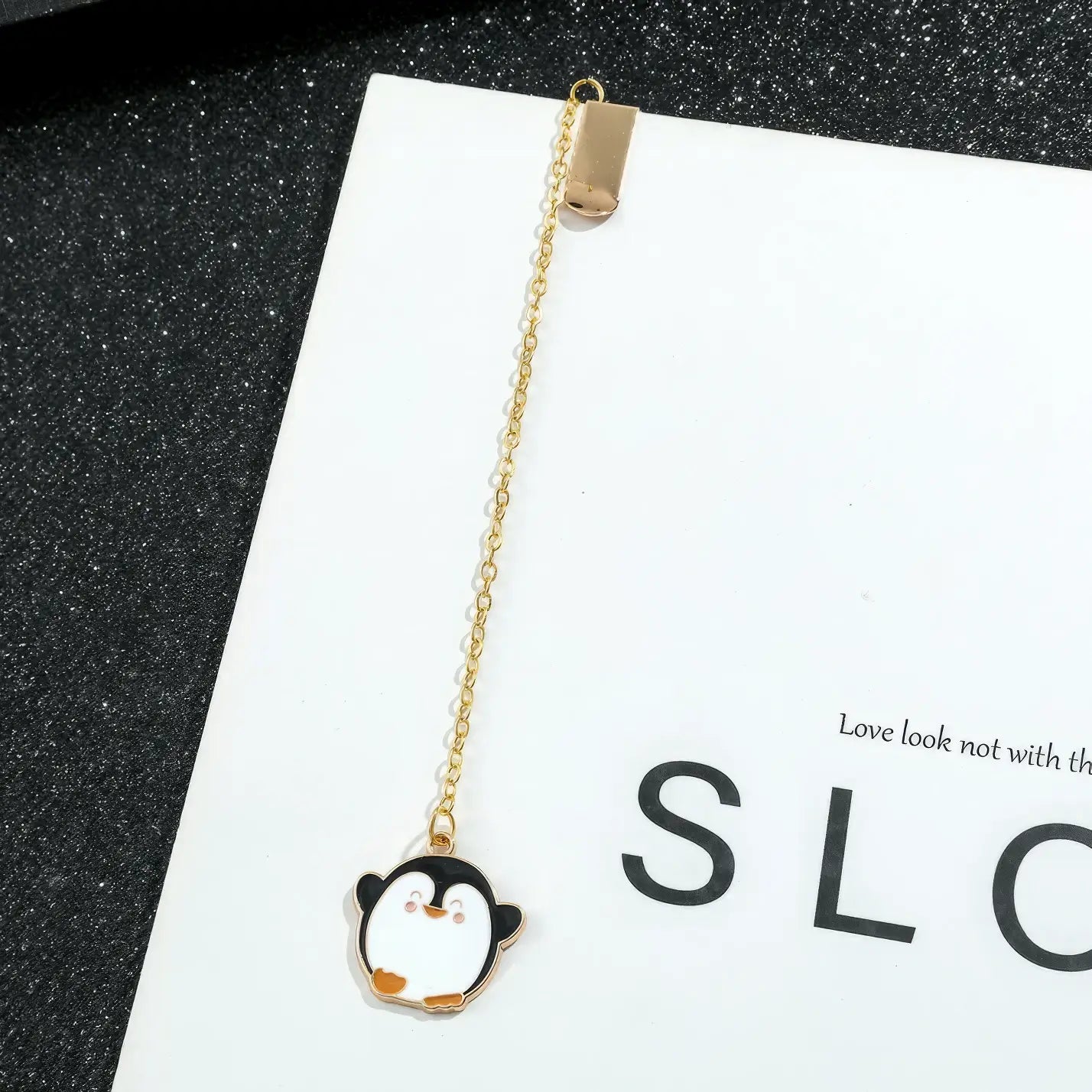 Animal and plant themed bookmark with penguin charm, golden chain, on "SLC" card