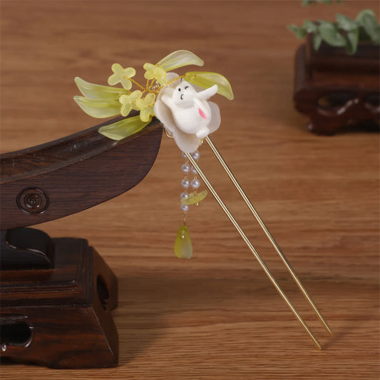 Baituigui hairpin with rabbit, green flower and tassel, wooden background