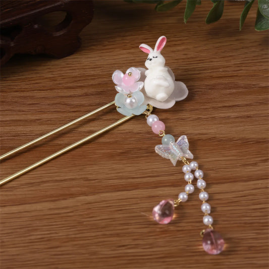 Baituigui hairpin with rabbit, pink pearl and tassel, wooden background
