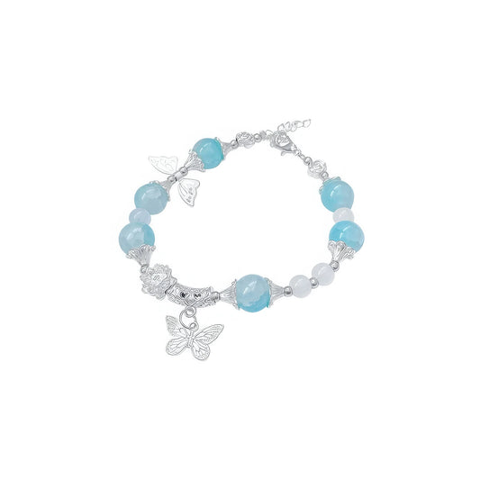 Blue butterfly beaded bracelet, isolated on white background, showcasing delicate design