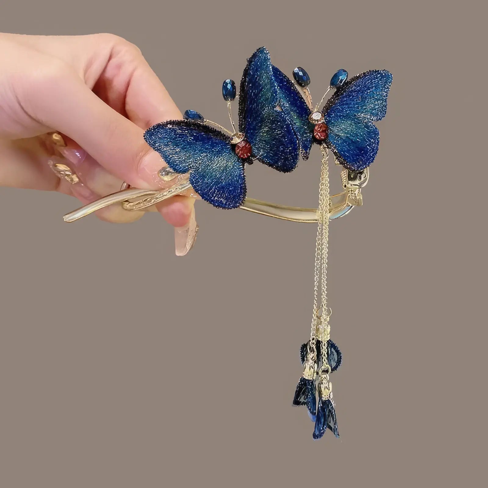 Detail of blue butterfly twist clip with tassel
