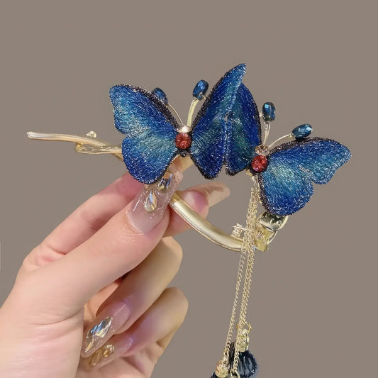 Blue butterfly twist clip held by hand
