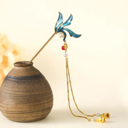 A blue-tail wave hairpin with blue leaf and long tassel, detailed close-up