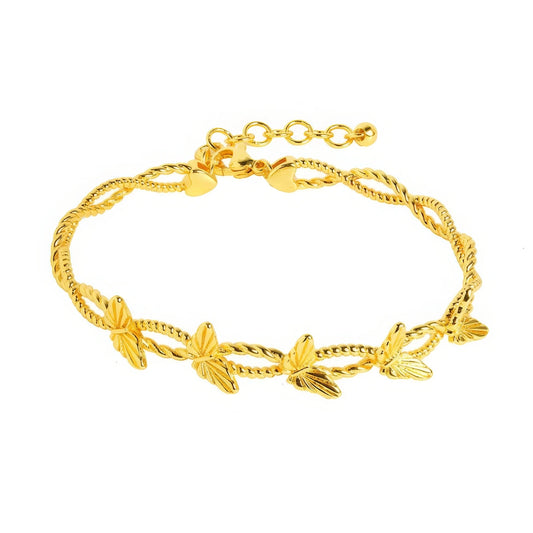 Gold butterfly bracelet, isolated on white background, showcasing delicate design