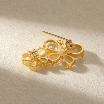 Gold butterfly diamond brooch, back view, showcasing pin mechanism