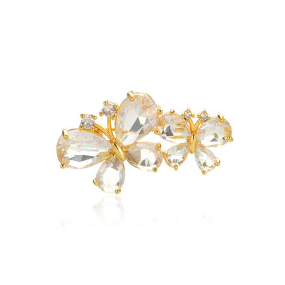 Gold butterfly diamond brooch, isolated on white background, clear details