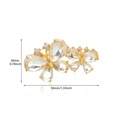 Gold butterfly diamond brooch with size specs (39mm x 15mm), isolated on white background