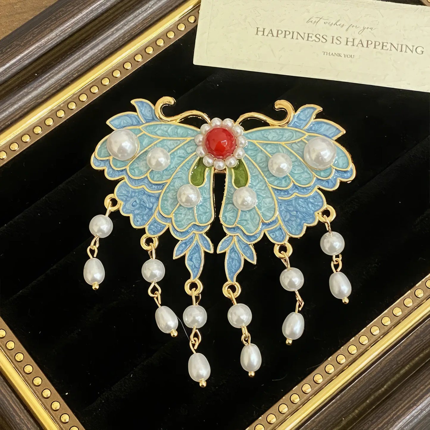 Butterfly and flower hair clip set, gold - detailed with blue elements and pearls, in a dark - colored display frame