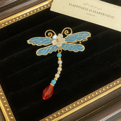 Butterfly and flower hair clip set, blue and gold combination with gemstone accents, in a velvet - lined display