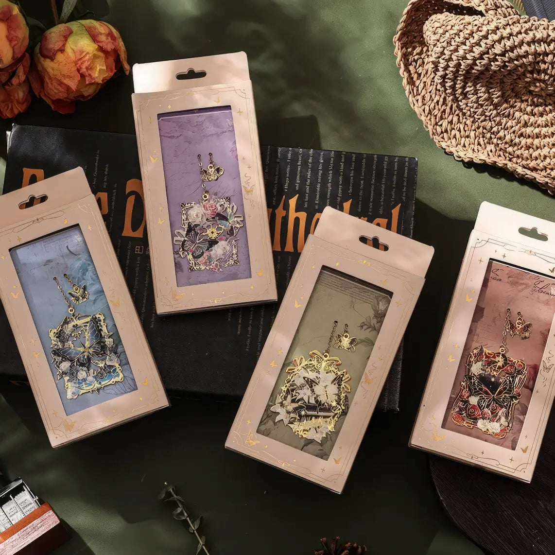 Butterfly - shaped metal lattice bookmark beside an inkwell and a quill pen on a table, creating an artistic atmosphere, realistic product display style, 3:4 ratio