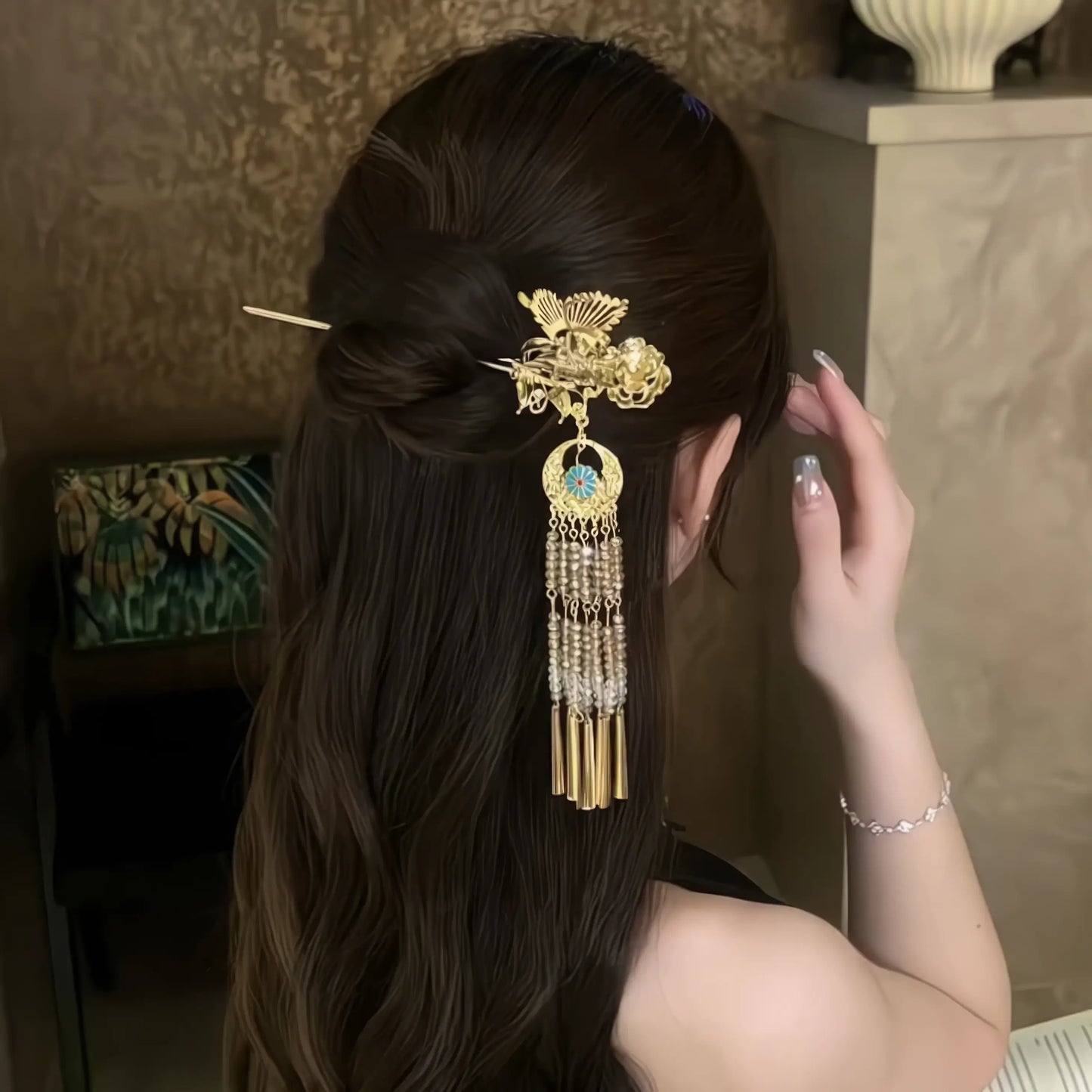 Butterfly-peony tassel hairpin in half-up hairstyle, tassels swinging with hand movement