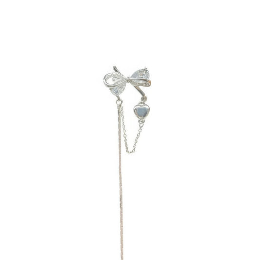 Single silver butterfly zircon ear cuff with short tassel, isolated on white