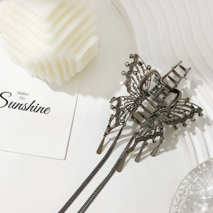 Black cat - eye stone butterfly claw clip displayed on white surface with “Sunshine” card