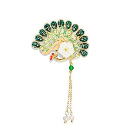 Peacock - shaped Chinese - style flower tassel brooch with green decorations, on wooden background