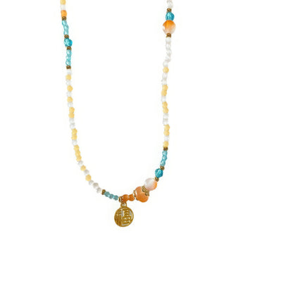 Colorful beaded necklace with gold pendant, isolated on white background