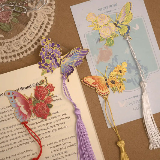 Colorful butterfly metal bookmarks with mixed tassels on open book