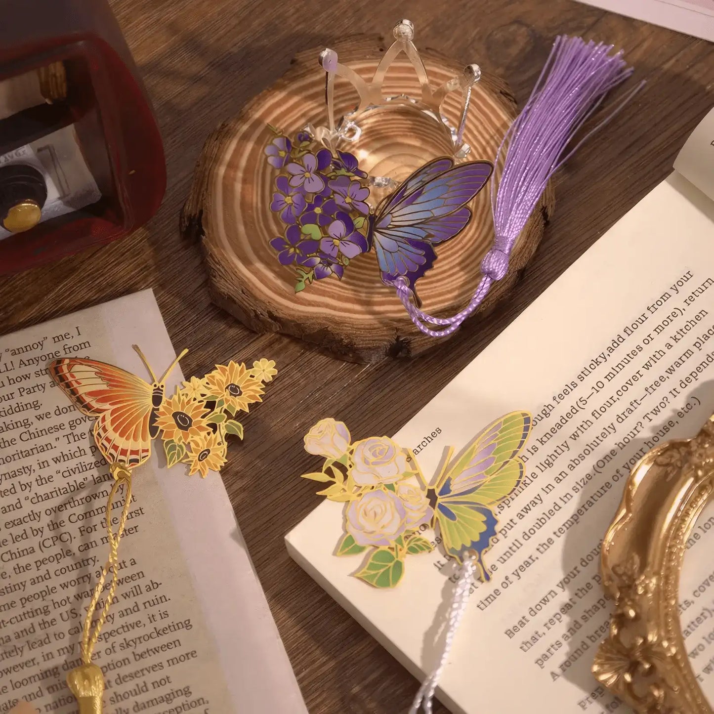 Display of colorful butterfly metal hollow - out bookmarks with tassels