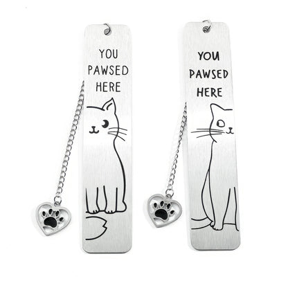 Two cute cat stainless steel bookmarks with chain and paw charm, isolated on white background