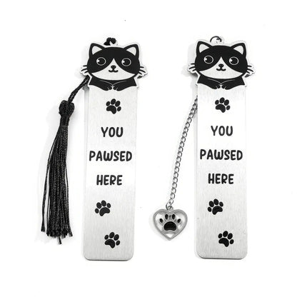 Pair of cute cat stainless steel bookmarks with chain and paw charm, isolated on white background

