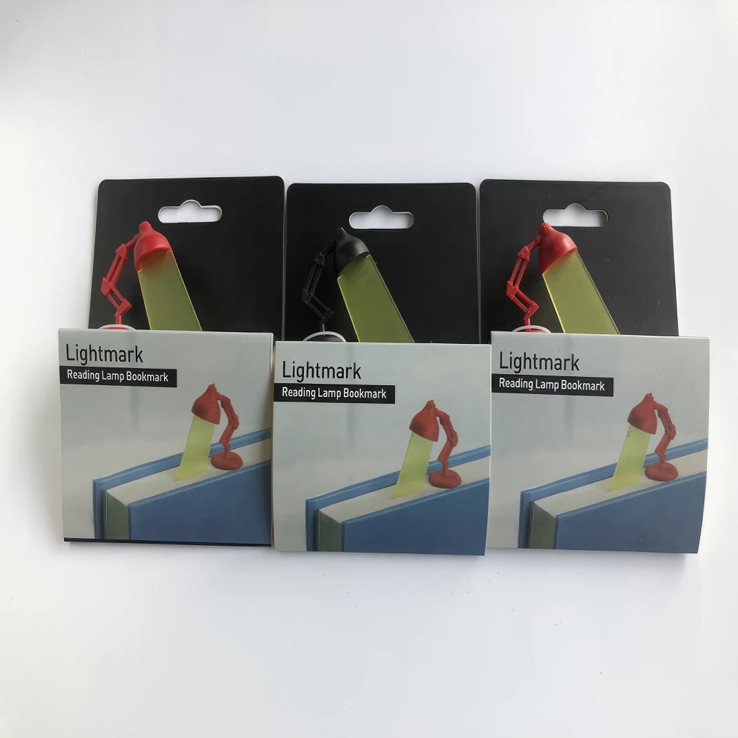 Multiple desk lamp - shaped bookmarks in packages, isolated on white background