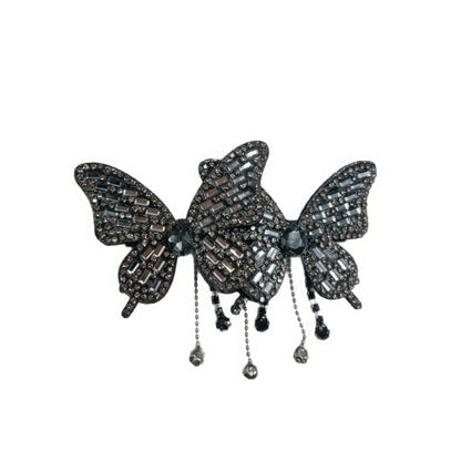 Black double butterfly tassel hair clip isolated on white background