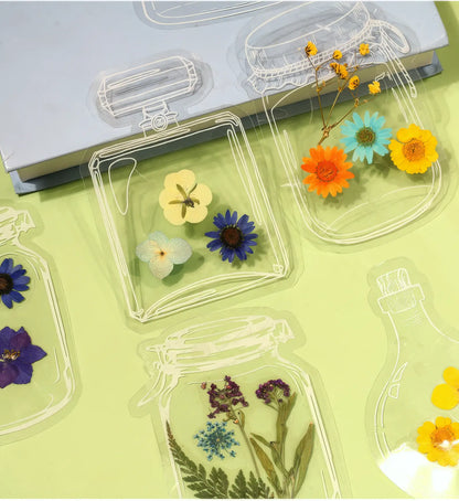 Transparent bookmark with white jar outlines, isolated on black background