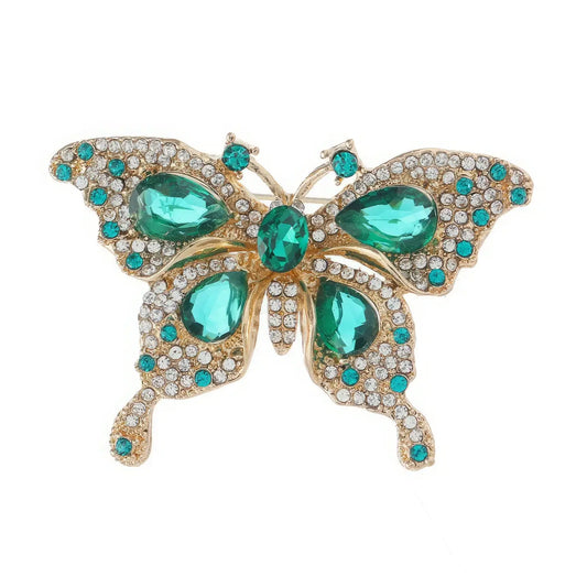 Front view of emerald jade butterfly brooch, isolated on white, clear gem details