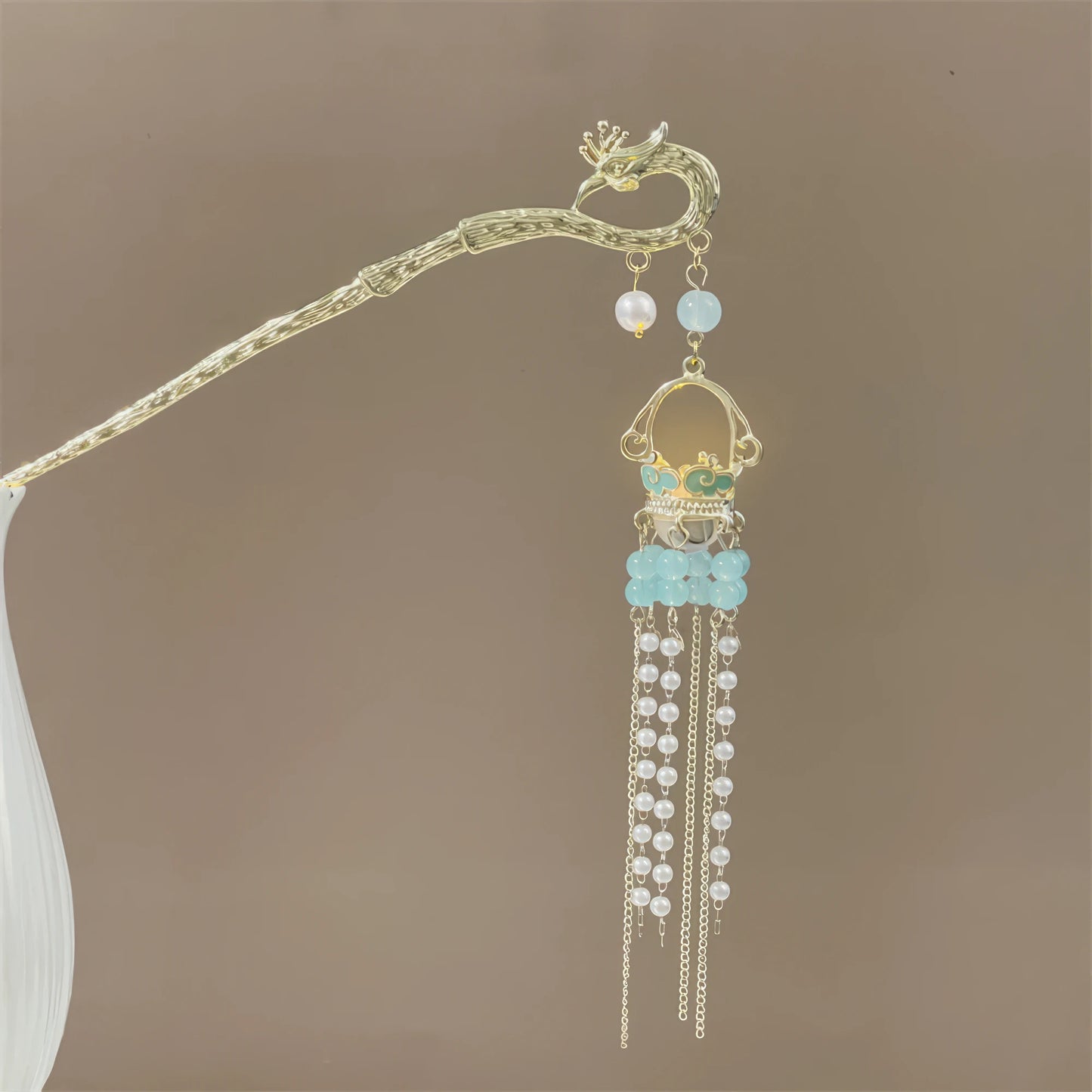 Fengzan Lighthouse Brilliance hairpin 3 with gold rod, green beads, and green tassel, light brown background