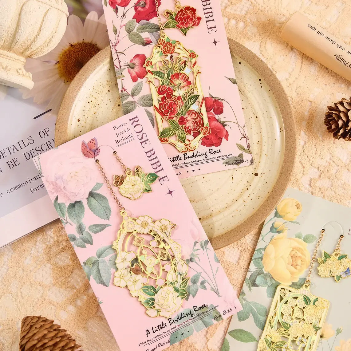 Floral story bookmark in green package, displayed on light surface with stationery in background