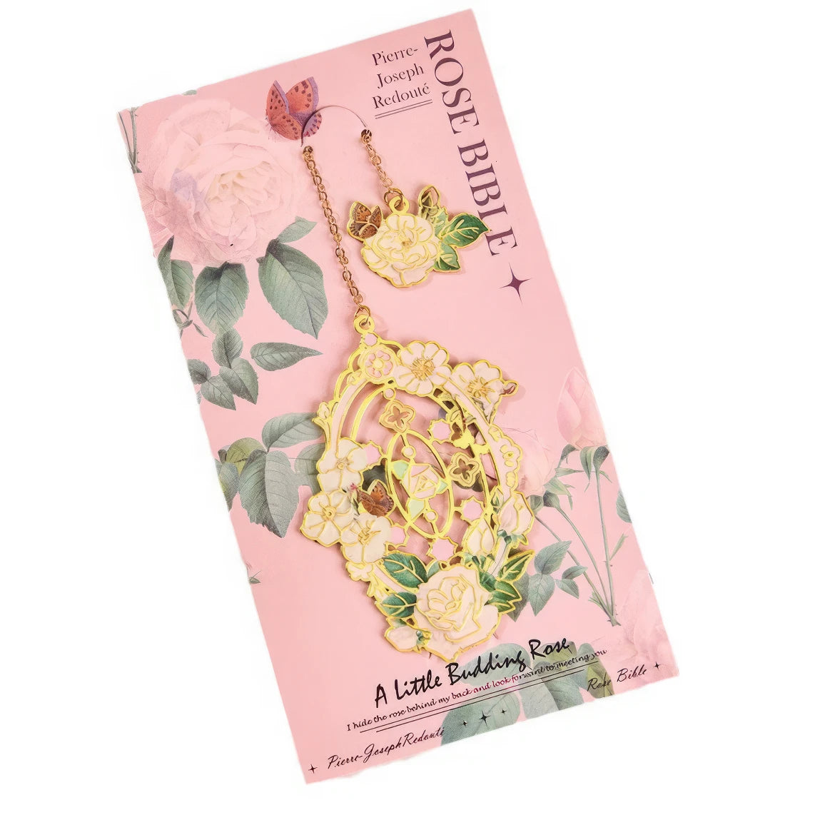 Floral story bookmark in pink package, displayed on light surface with stationery in background
