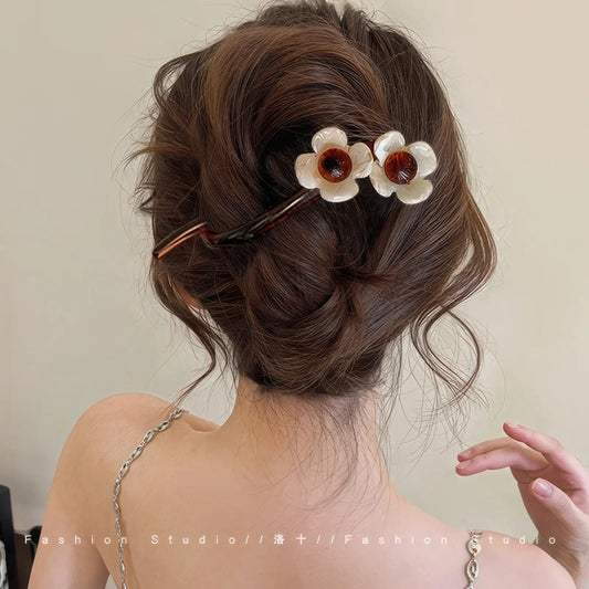 Flower twist hair clip (brown flowers) worn in updo hairstyle