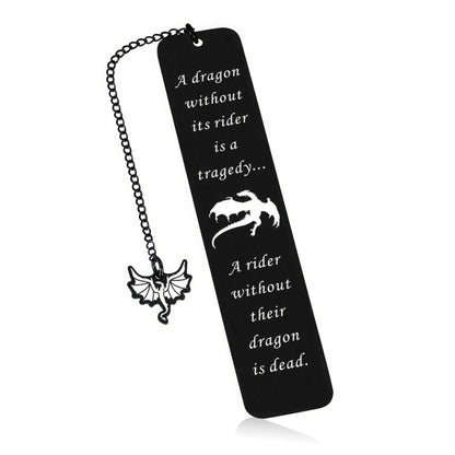 Black four - winged dragon metal bookmark with charm, isolated on white