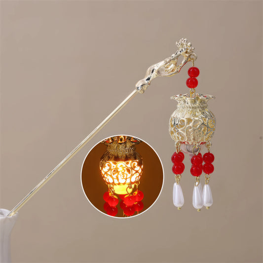 Futu Huadeng hairpin, gold rod, red beads, white pendants, small lit yellow lantern inset, beige background