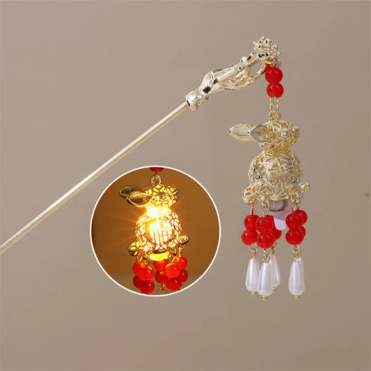 Futu Huadeng hairpin, gold rod, red beads, white pendants, small lit yellow lantern inset, beige background