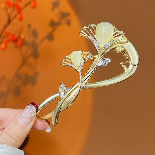 Gold - toned flower - shaped twist hair clip