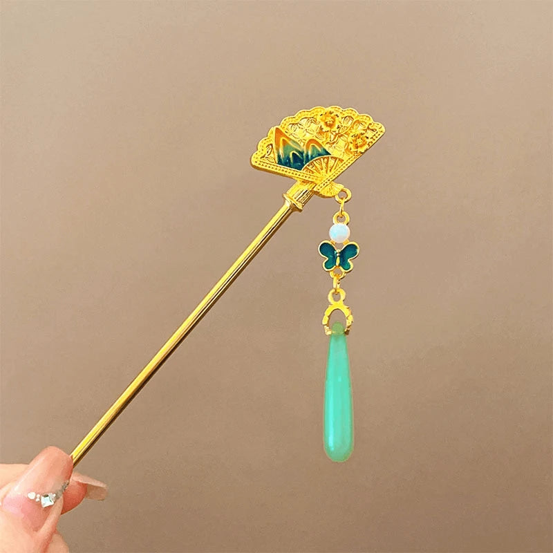 Golden large fan-shaped hairpin with green jade pendant, closeup view