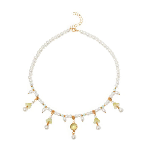 Grass green cabochon lily necklace with pearls, isolated on white background