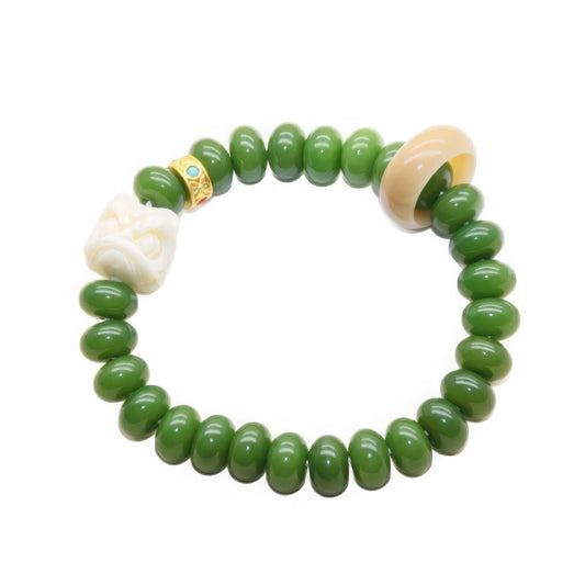 Single - strand green bodhi bracelet with white and beige accent beads, emphasizing craftsmanship
