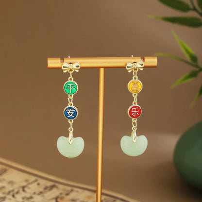 Colorful beaded earrings with light green drops on gold hanger, green vase and scroll