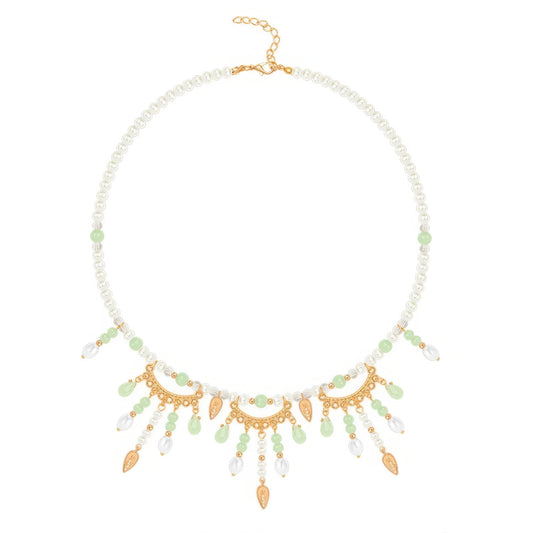 Green multi - hole necklace with pearls and gold details, isolated on white background