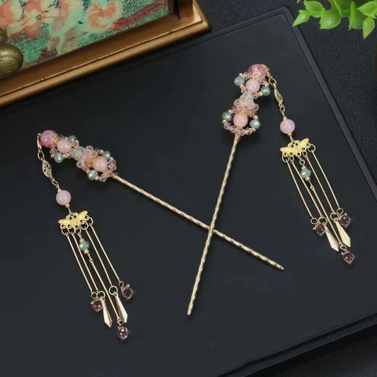 Set of purple beaded hairpins with tassels, cross arrangement