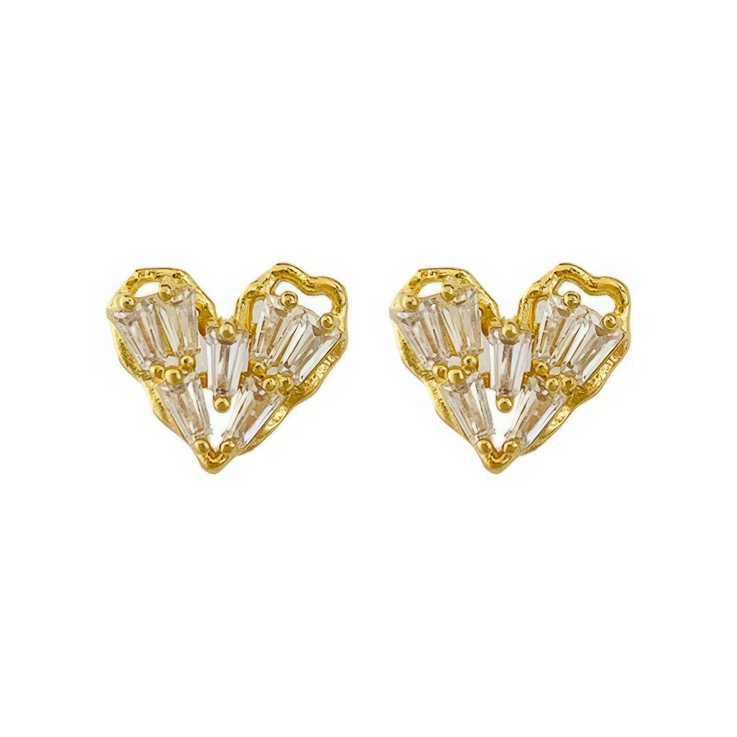 Pair of gold - framed heart - shaped earrings, isolated on white background
